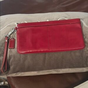 Coach Red patent Leather Wristlet Clutch with Sleek Design